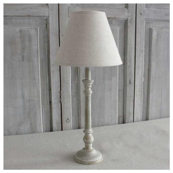 Antique White Wood Table Lamp with Linen Shade on top of a table.